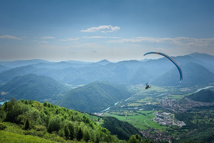 A paraglider sailed over Tolmin