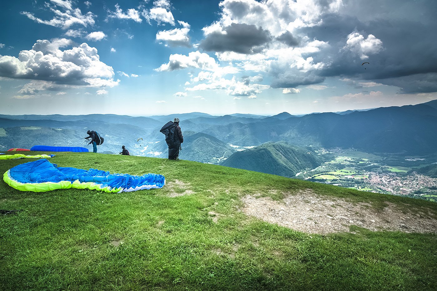 Paragliders are preparing to take off above Tolmin
