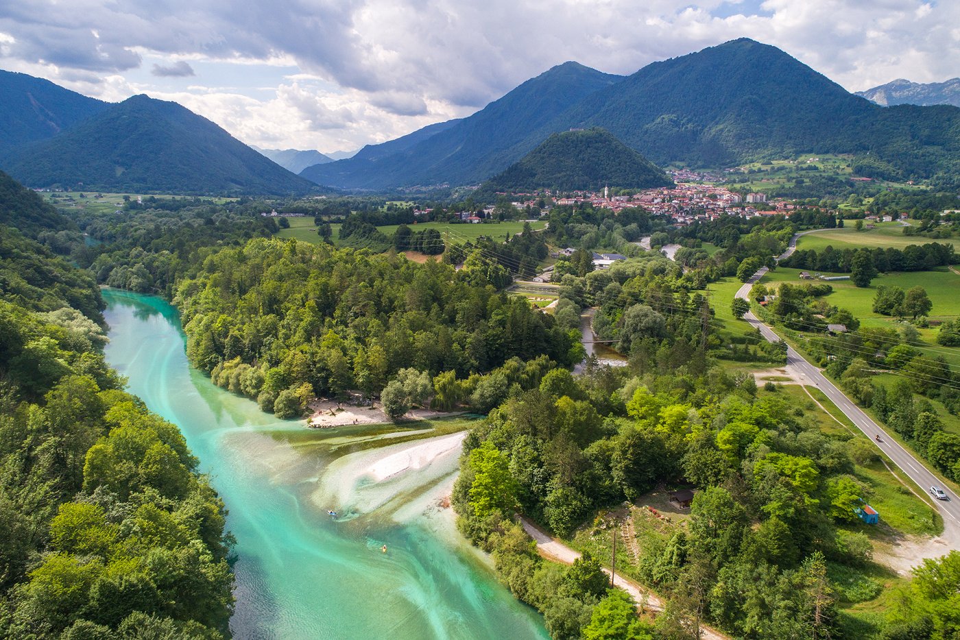View of the confluence of the Soča and Tolminka rivers, in the background the town of Tolmin and the local mountains